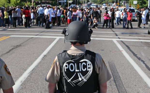 Ministers try peaceful protest through Ferguson